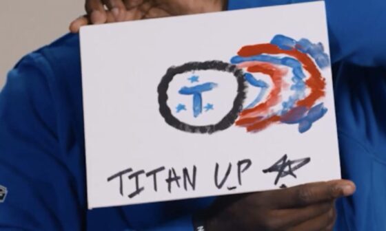 Tyjae Spears paints the Titans logo
