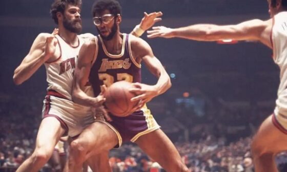 Kareem Abdul Jabbar being guarded by Phil Jackson, I think the image goes quite hard