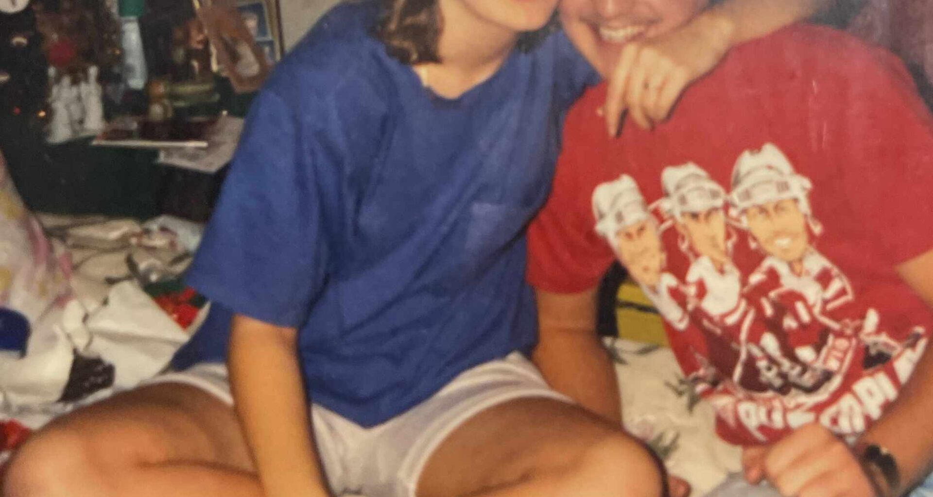 This is a photo of my parents from back in the day. Could somebody tell me who is on my dad's shirt?