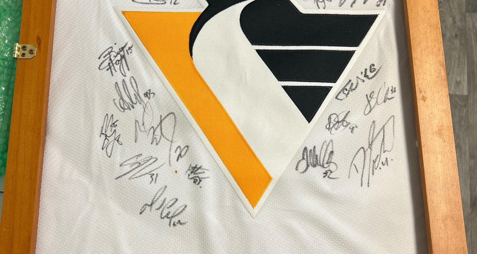 Update on previous post: Jersey came in and I’m fairly certain that it is a Lemieux signature that was hiding behind the mini stick! Thank you to all who helped identify the signatures across the jersey!!