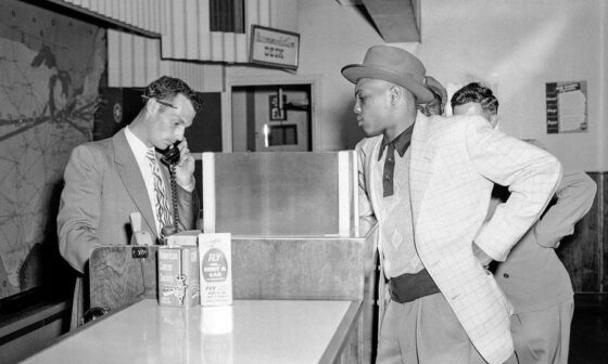Willie Mays in Omaha getting a plane ticket to fly to New York City to make his MLB debut the next day, May 24, 1951.