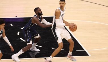 Victor Wembanyama's late surge after early foul trouble not enough to lift Spurs past Mavericks in NBA debut