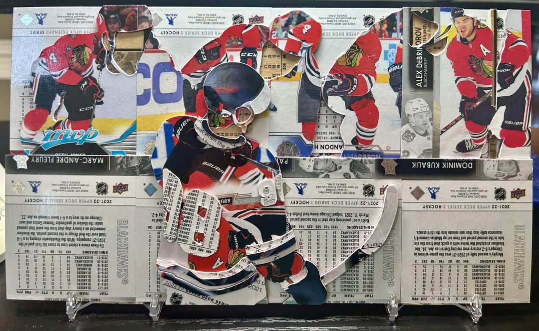 Connor Bedard celebrating with the bench, made entirely out of hockey cards