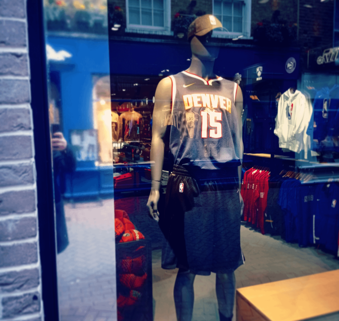 Official NBA store in London features Nuggets - Jokic jersey.