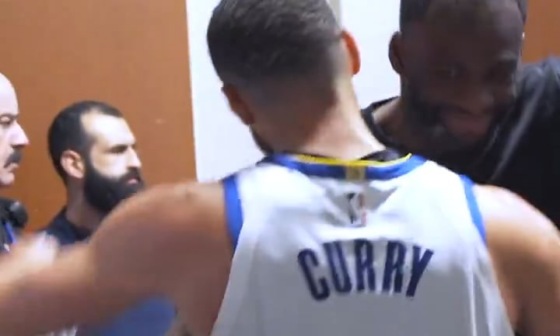 Draymond Green meets Steph Curry at the end of the tunnel with the 'Night Night' pose and they give each other a celebratory hug