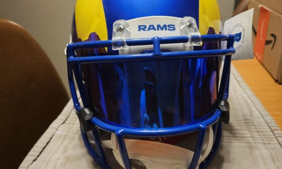 Isaac bruce authentic signed helmet.
