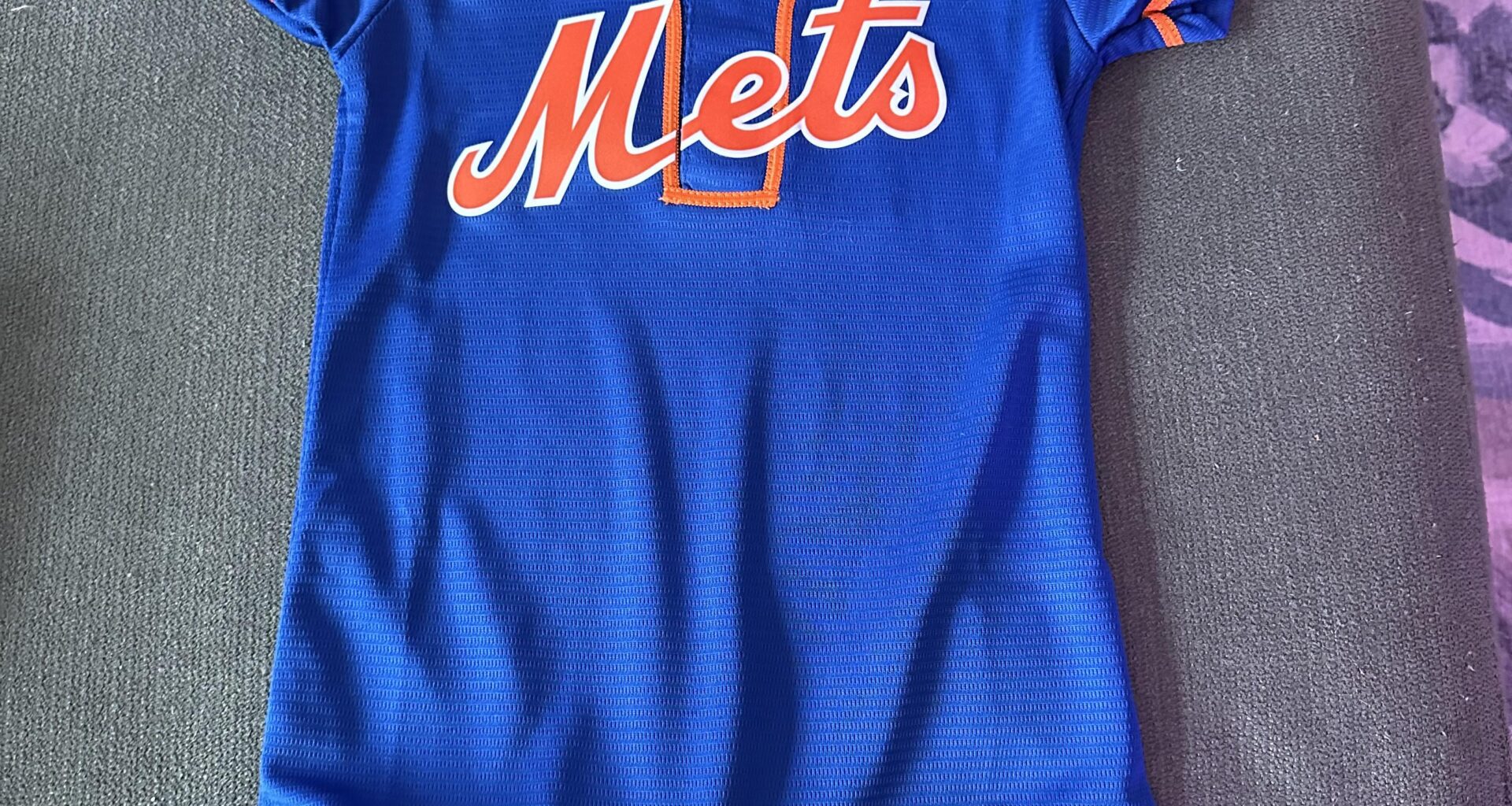 My wife and I are expecting our first child, a baby boy, this September. I saw this in Kohls and while it’s a 12M it’s the only one they had and I couldn’t resist. Gotta start em young!