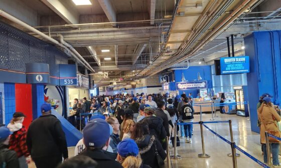 This is the Hello Kitty bobblehead queue. We're outside section 535. The bobbleheads are at the ground floor. Not a great look, Jays & Rogers