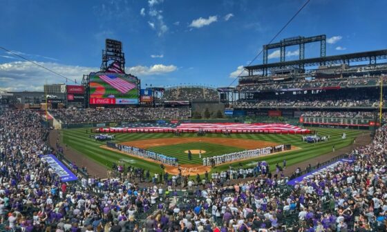Rockies Coach in pilot seat while charter flight in air