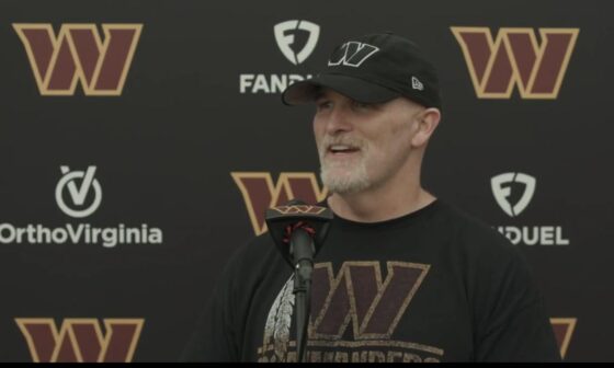 Dan Quinn rocking a shirt with the W Commanders logo combined with the old Skins feather is… interesting