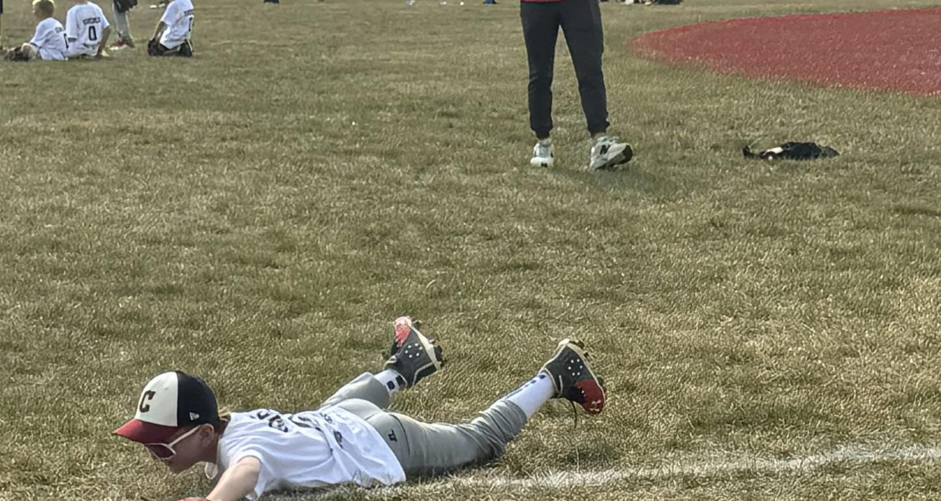 Awesome picture of my son and Giminez at the pro camp yesterday. He said my son was making it look too easy so threw him a hard grounder and my son laid out in a dive for it. They both got a good laugh out of it.