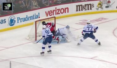 Jack Hughes scores a goal against the Tampa Bay Lightning
