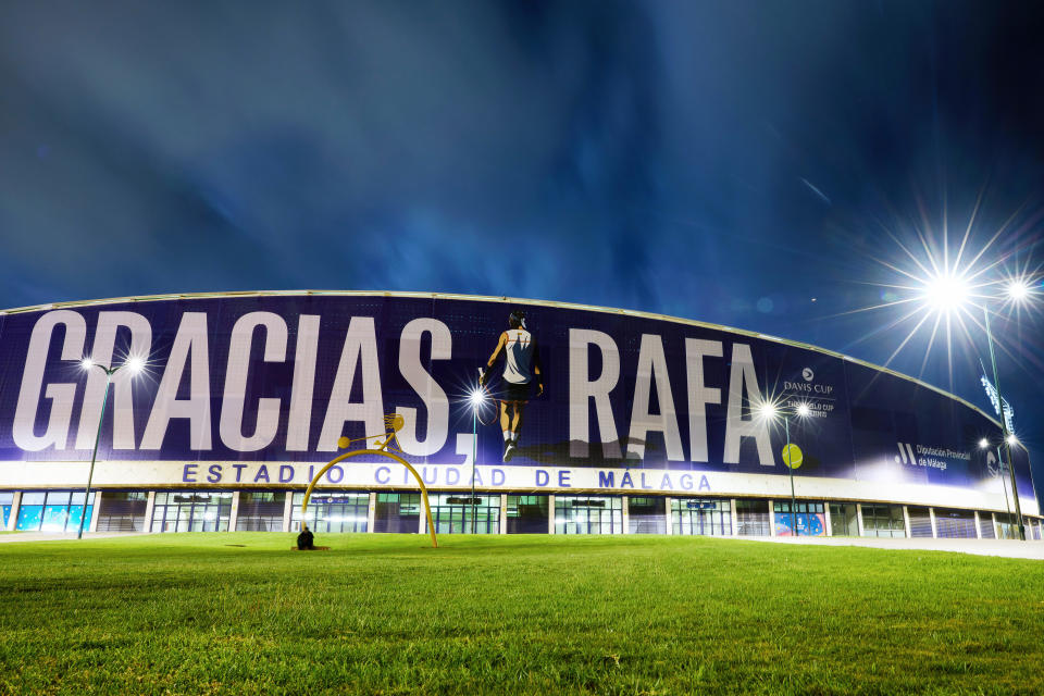 The Davis Cup arena is plastered with a sign reading