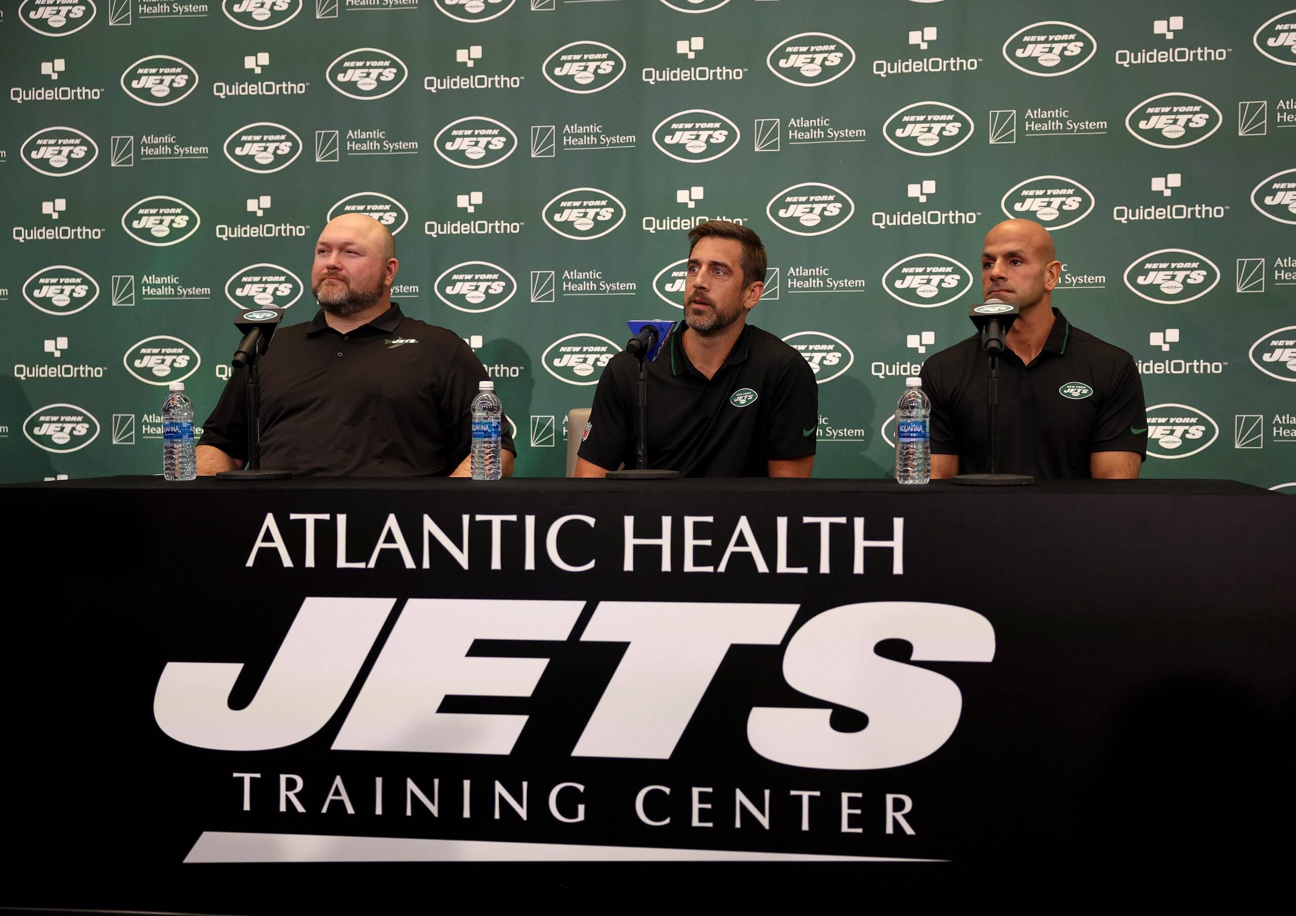 New York Jets general manager Joe Douglas, quarterback Aaron Rodgers and head coach Robert Saleh attend a press conference at Atlantic Health Jets Training Center on April 26, 2023 in Florham Park, New Jersey.