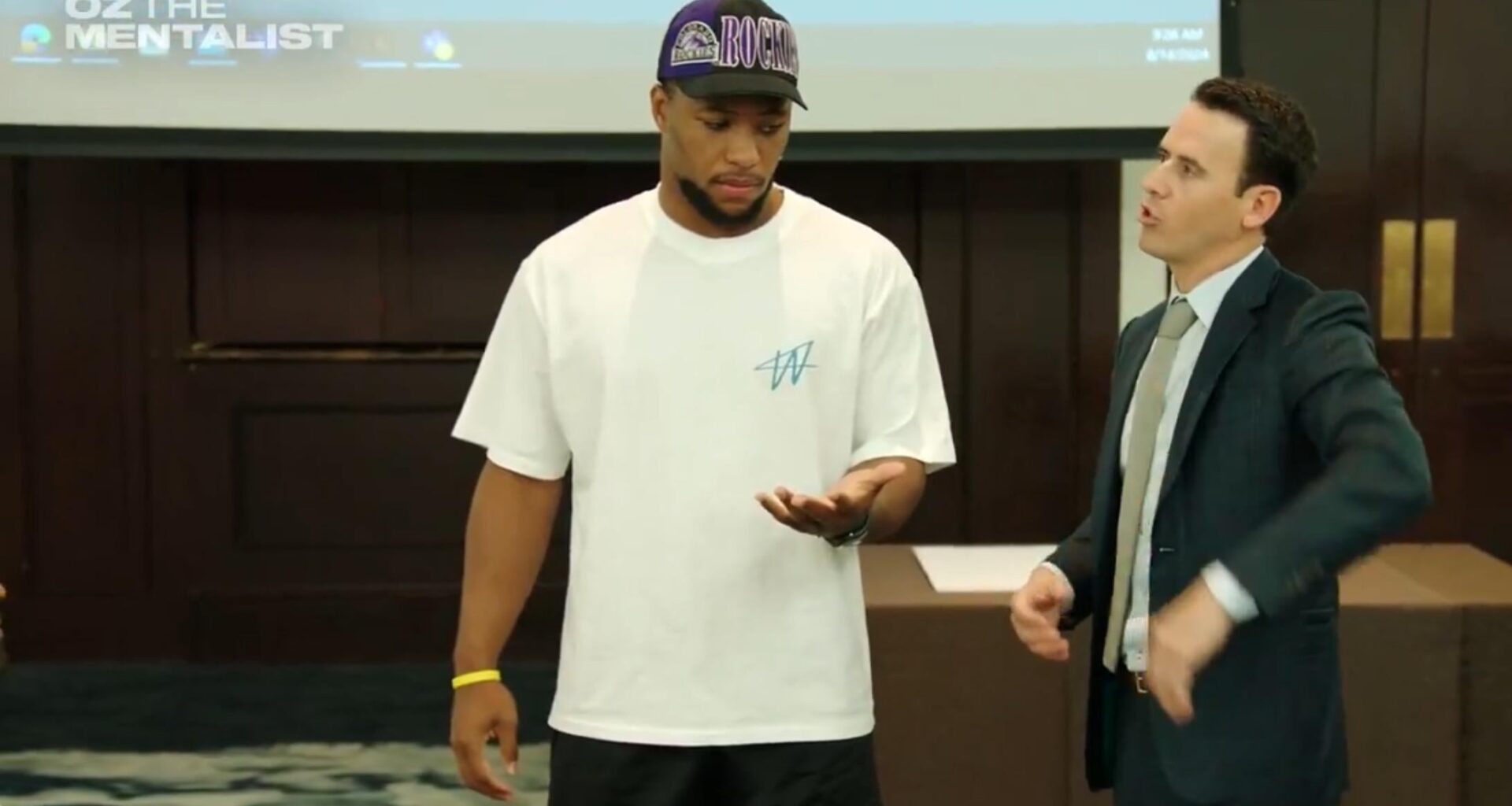 Saquon Barkley sporting a Rockies hat during an Eagles team event.