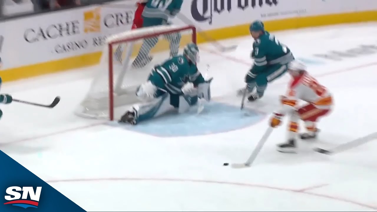 Sharks’ Yaroslav Askarov stuns Flames’ Jakob Pelletier with acrobatic stop