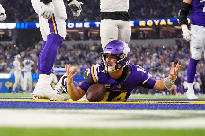 Minnesota Vikings quarterback Sam Darnold reacts after being <a href=