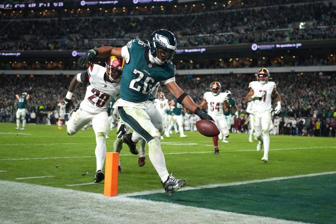 Philadelphia Eagles running back Saquon Barkley scores during his team's <a href=