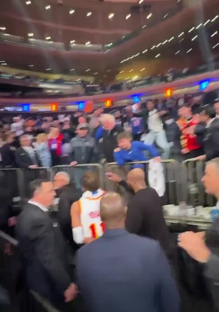 A Knicks fan mocks Trae Young as he's leaving the court. Trae goes to dap him up but leaves him hanging. Cold blooded.