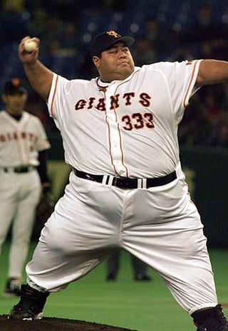 Weighing in at over 600 lbs (or approximately two William Howard Tafts), Hawaiian sumo wrestler Konishiki throws out the first pitch at the 1998 Super Dome All-Star Series in Tokyo