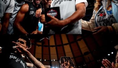 Steph Castle receives his National Championship ring from his family in New York