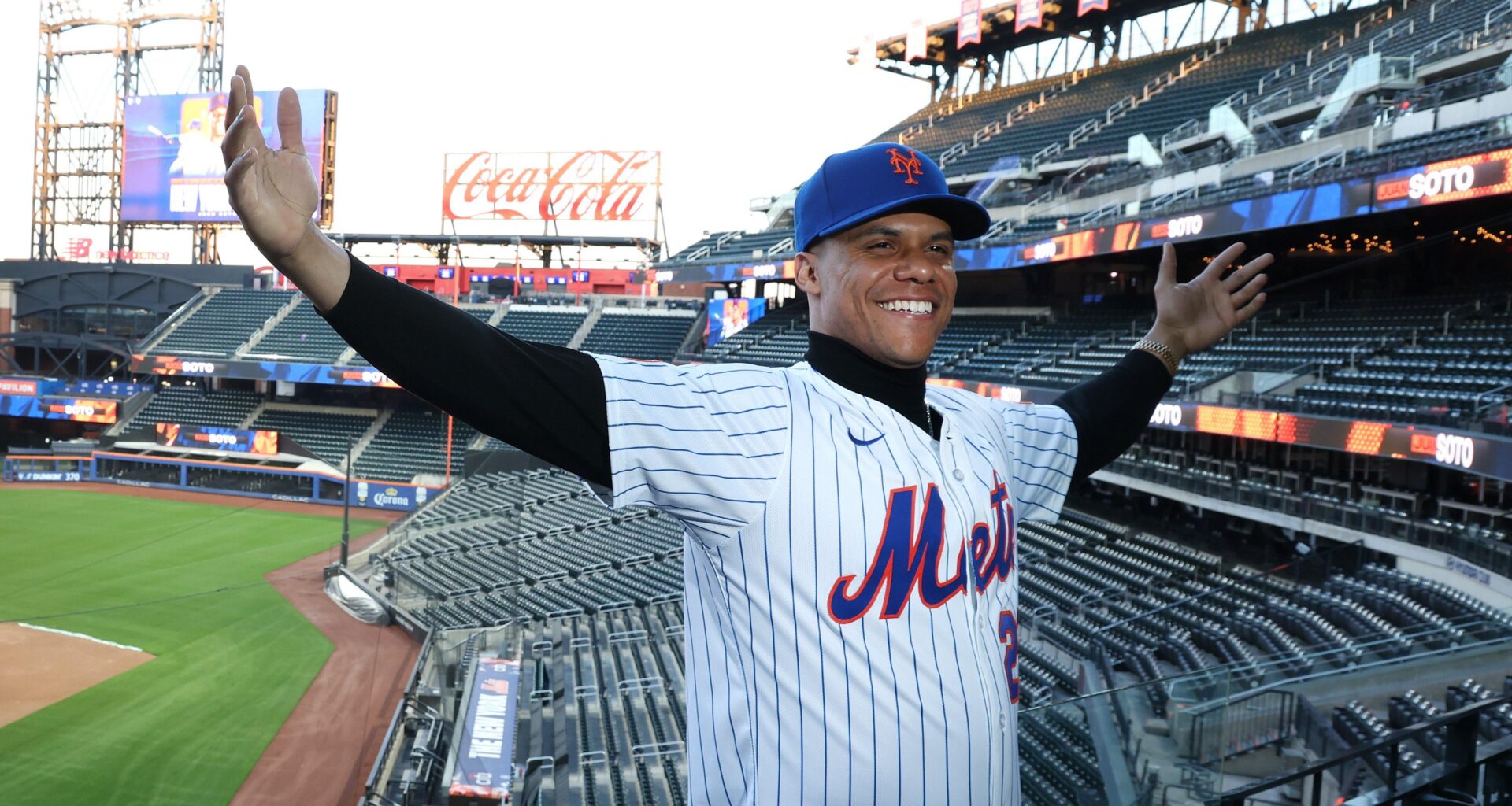 Juan Soto poses in front of Citi Field, his new home for the next 15 years