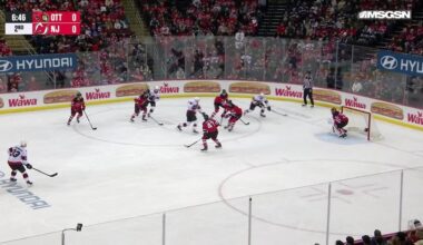 Zack Ostapchuk scores a goal against the New Jersey Devils