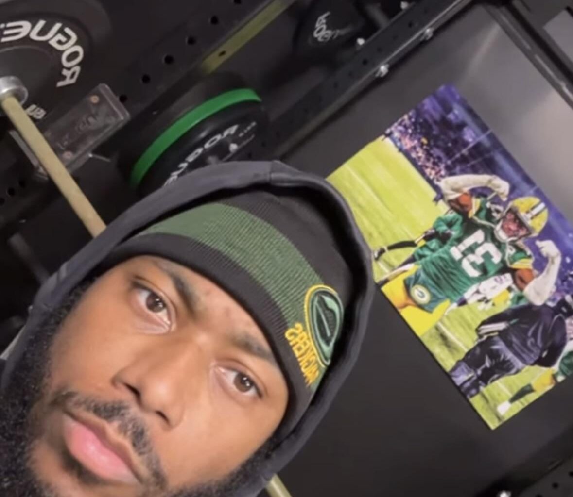 Former Green Bay Packers safety Adrian Amos posted an Instagram story wearing a Packers hat with a picture of him in a Packers uniform in the background.