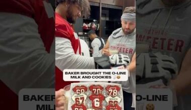 Baker giving the o-line cookies and milk so they can grow big and strong