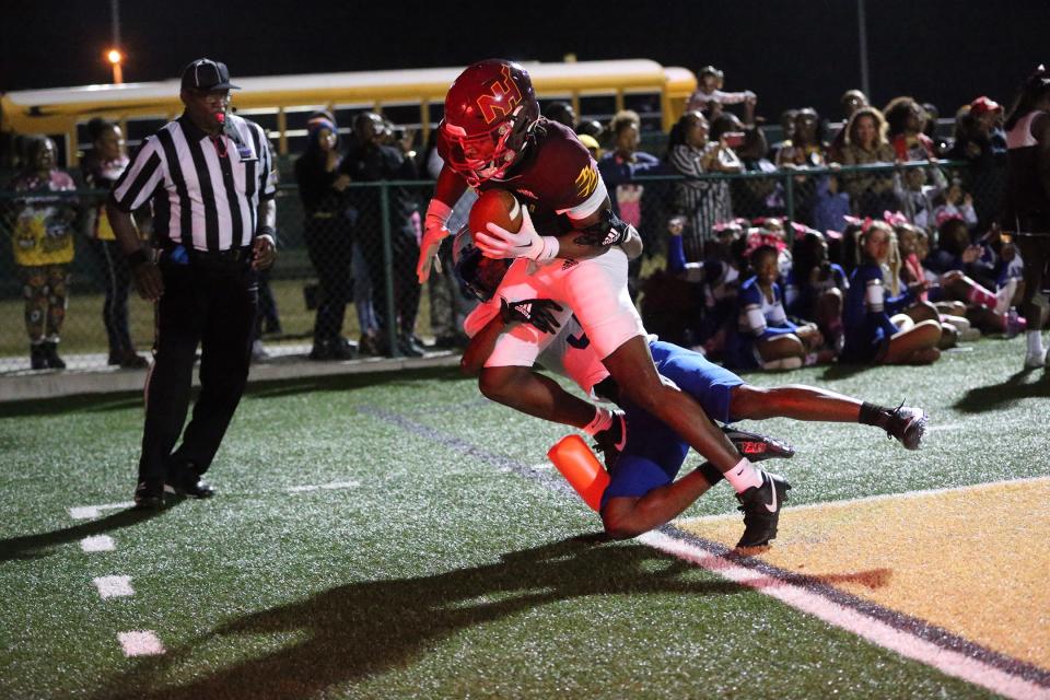 New Hampstead receiver Jaylen Hampton is taken out of bounds by Burke County's Jakari Crawford after making a touchdown catch in the end zone during a 2023 game at Pooler Stadium.