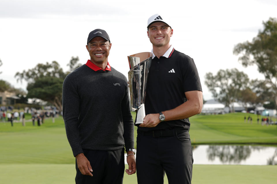 LA JOLLA, CALIFORNIA - FEBRUARY 16: Tiger Woods (L) and Ludvig Åberg of Sweden pose for photos with the trophy after Åberg won The Genesis Invitational 2025 at Torrey Pines Golf Course on February 16, 2025 in La Jolla, California. (Photo by Harry How/Getty Images)