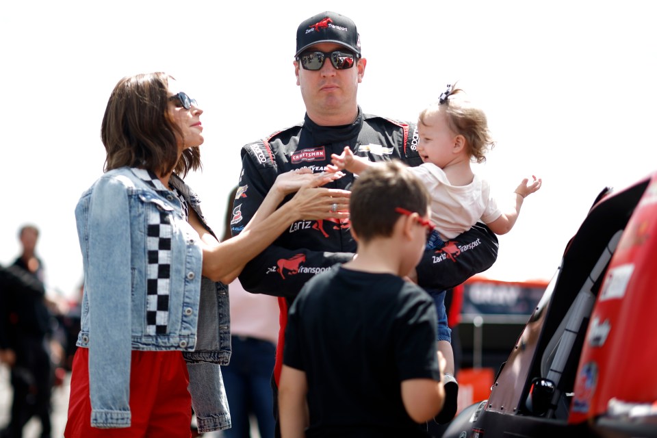 Kyle Busch with his family at a NASCAR race.