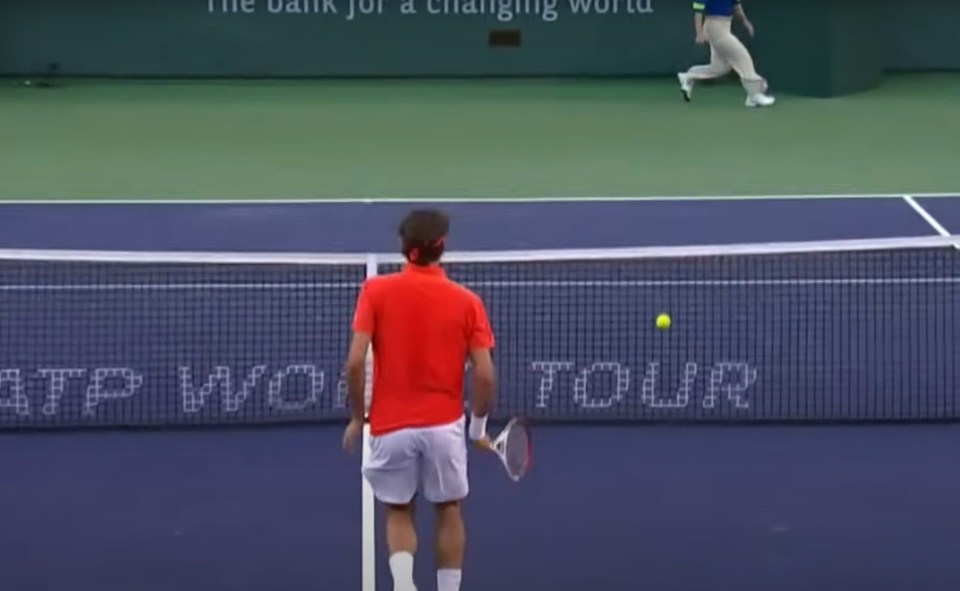 His opponent returned the serve and he hit the ball into the net