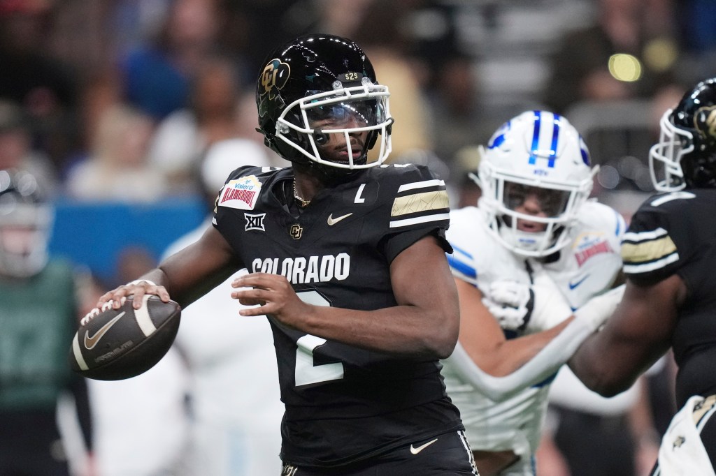 Colorado quarterback Shedeur Sanders (2) looks to throw against BYU during the first half of the Alamo Bowl NCAA college football game, Saturday, Dec. 28, 2024, in San Antonio. 