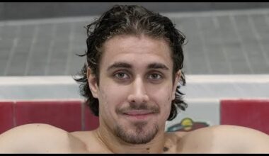 Khutsy in a Jacuzzi drinking from a coozy