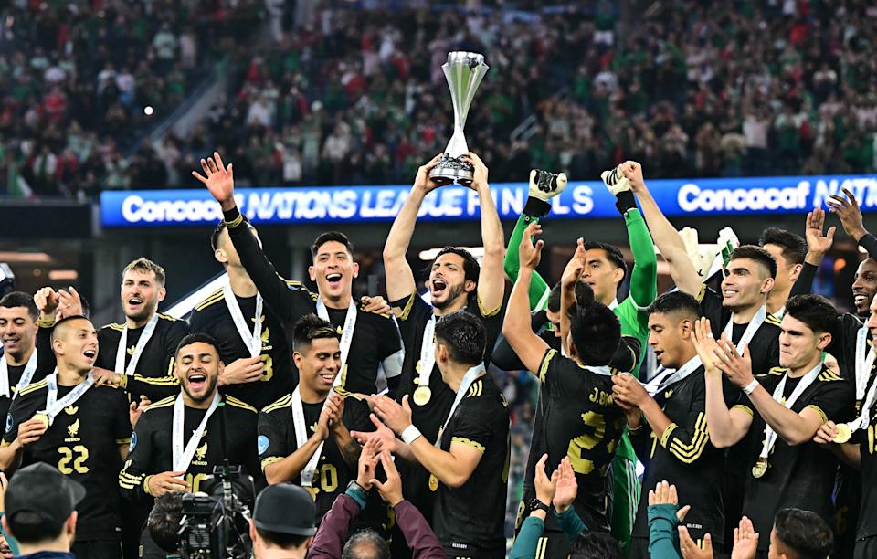 Mexico's forward #09 Raul Jimenez holds Concacaf Nations League Cup as the team celebrates on the podium after winning the CONCACAF Nations League final football match against Panama at SoFi Stadium in Inglewood, California, on March 23, 2025. (Photo by Frederic J. Brown / AFP) (Photo by FREDERIC J. BROWN/AFP via Getty Images)          