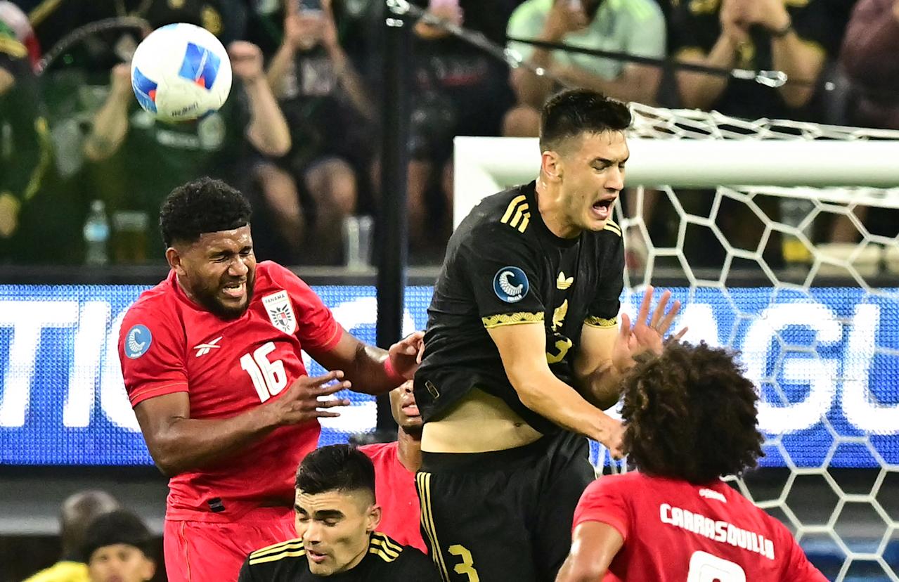 Panama's midfielder #16 Carlos Harvey and Mexico's defender #03 Cesar Montes jump to head the ball during the CONCACAF Nations League final football match between Mexico and Panama at SoFi Stadium in Inglewood, California, on March 23, 2025. (Photo by Frederic J. Brown / AFP) (Photo by FREDERIC J. BROWN/AFP via Getty Images)          