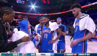 The Oklahoma City Thunder players dress up Nick Gallo with OKC gear during the postgame interview on the court.