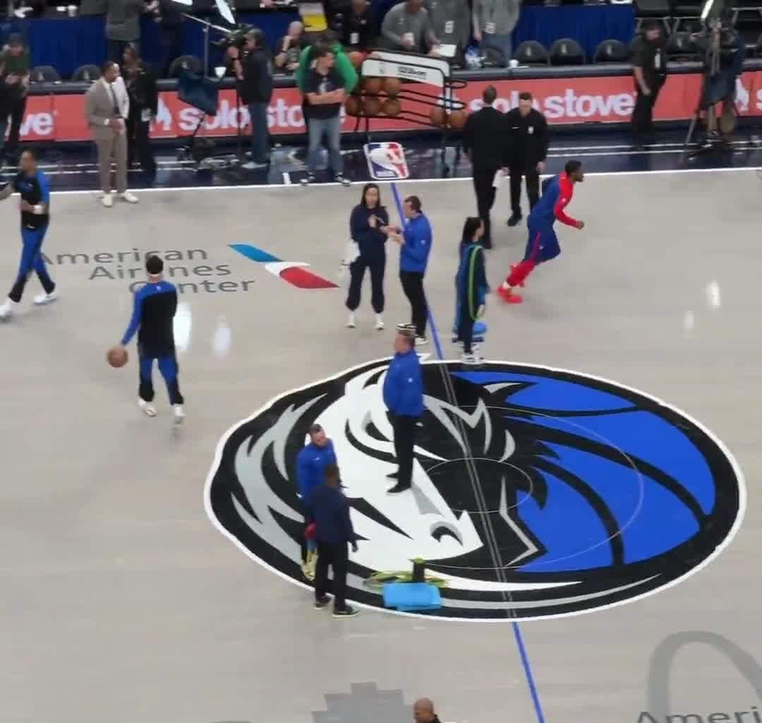 A historic 20 players combined are listed OUT between the Mavs vs 76ers today. A camera pans around, but only 6 and 7 players from each team are seen warming up.