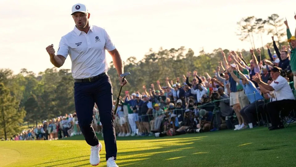 Bryson DeChambeau after making a long birdie putt on the 18th hole of Augusta National to pull him within two shots of the lead. - David J. Phillip/AP