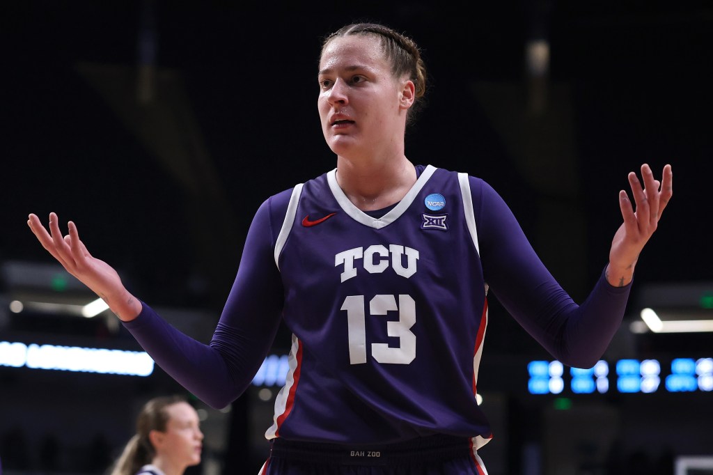 Sedona Prince #13 of the TCU Horned Frogs in a purple uniform reacting during a game against the Texas Longhorns in the NCAA Women's Basketball Tournament