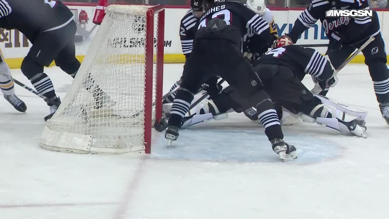 Evgeni Malkin scores a goal against the New Jersey Devils