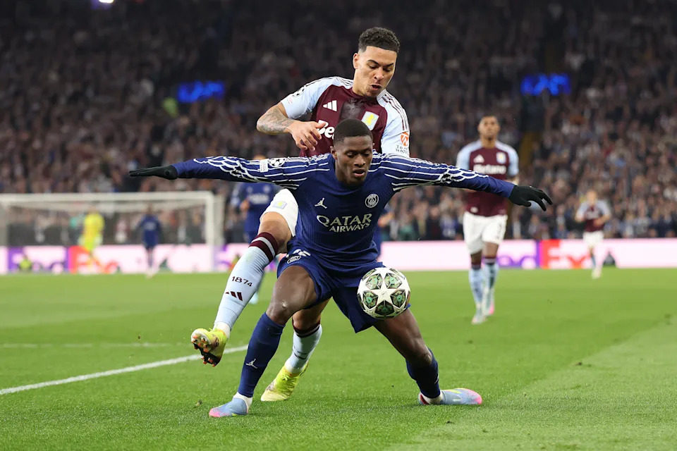 BIRMINGHAM, ENGLAND - APRIL 15: Morgan Rogers of Aston Villa and Ousmane Dembele of Paris Saint Germain during the UEFA Champions League 2024/25 Quarter Final Second Leg match between Aston Villa FC and Paris Saint-Germain at Villa Park on April 15, 2025 in Birmingham, England. (Photo by Catherine Ivill - AMA/Getty Images)