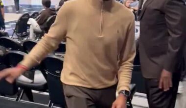 A fan yells "Fire Nico" right in Nico Harrison's face.