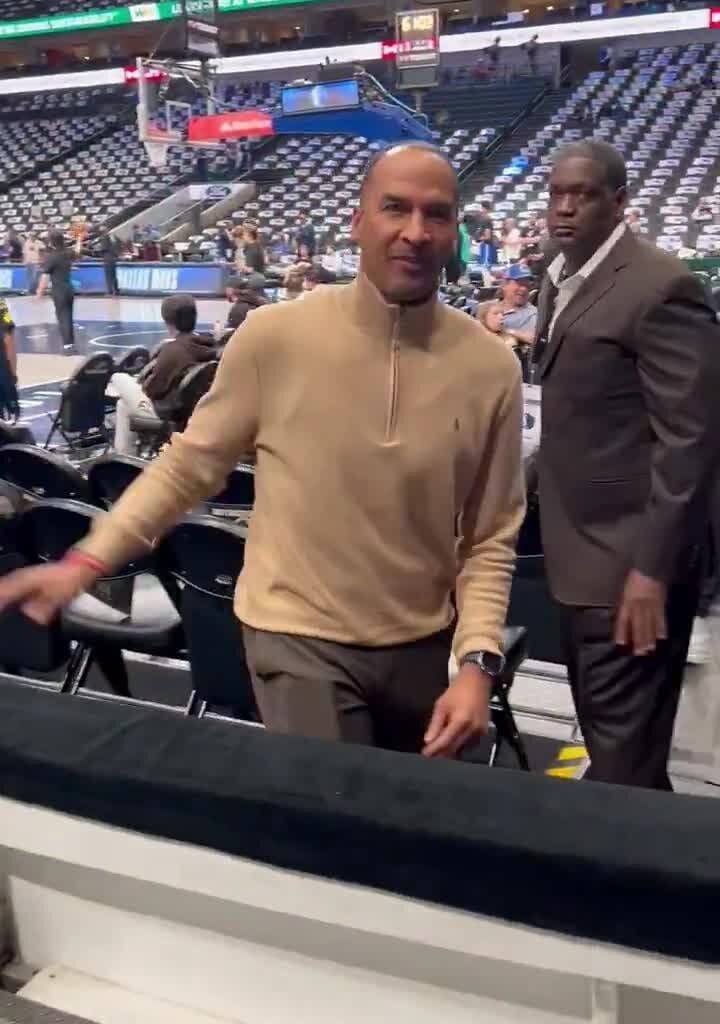 A fan yells "Fire Nico" right in Nico Harrison's face.