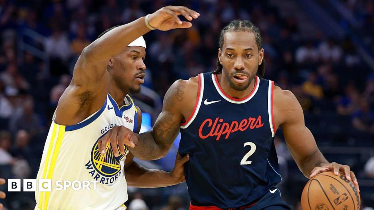 LA Clippers' Kawhi Leonard is guarded by Jimmy Butler III of the Golden State Warriors