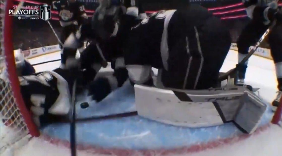 Byfield covering the puck with 2 hands in the blue paint. No call