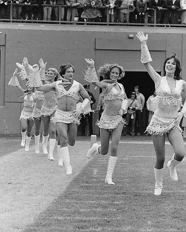 Robin Williams running onto the field as a Denver Broncos cheerleader, 1979.
