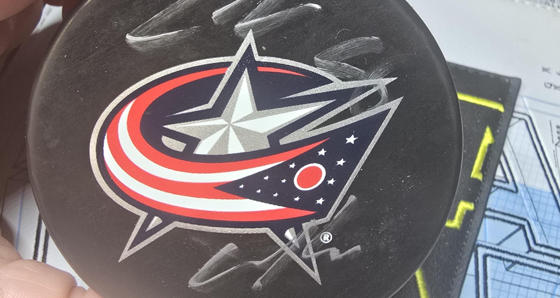 I won an autographed puck by zach werenski