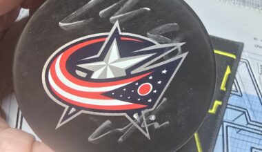 I won an autographed puck by zach werenski